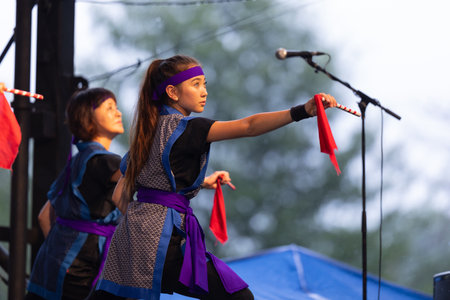 St. Louis, Missouri, USA - August 25, 2019: Festival of Nations, Tower Grove Park, Members of the St. Louis Eisa Okinawa Kenjin-Kai, wearing traditional clothing, performing traditional Okinawan, Japanese drum danceのeditorial素材