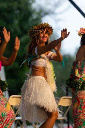 St. Louis, Missouri, USA - August 25, 2019: Festival of Nations, Tower Grove Park, Members of the Hawaiian Polynesian Revue, wearing traditional clothing, performing traditional Polynesian danceのeditorial素材