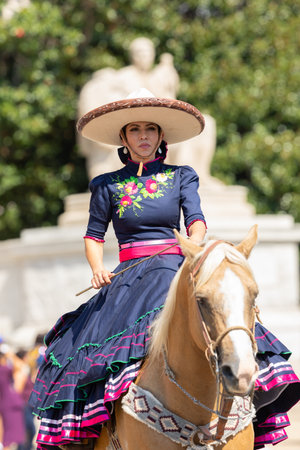 Washington DC, USA - September 21, 2019: The Fiesta DC, Mexican woman wearing traditional charro clothing, riding horse during the paradeのeditorial素材