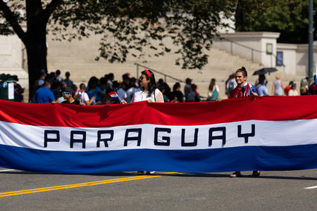 Washington DC, USA - September 21, 2019: The Fiesta DC, Paraguayans carrying a giant National flag down constitution avenue during the paradeのeditorial素材