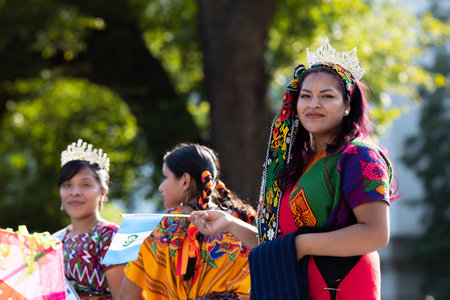Washington DC, USA - September 21, 2019: The Fiesta DC, Guatemalan beauty queen, wearing traditional clothing, with the Guatemalan flag, at the paradeのeditorial素材