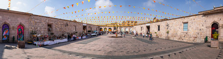 Morelia, Michoacan, Mexico - November 24, 2019: People shopping in a open air artisanal market, in the San Agustin temple patioのeditorial素材