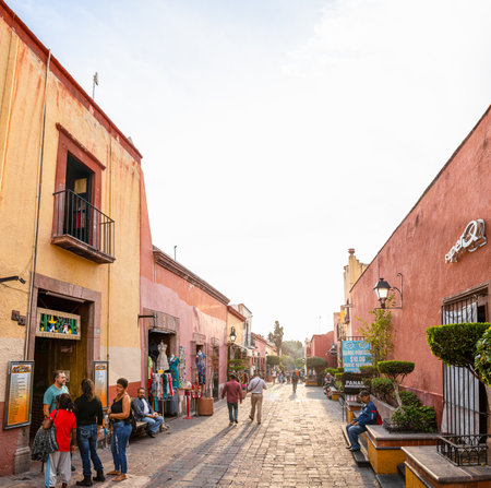 Santiago de Queretaro, Queretaro, Mexico - November 24, 2019: People walking at the 16 de septiembre street, late in the day, looking at the artisanal storesのeditorial素材