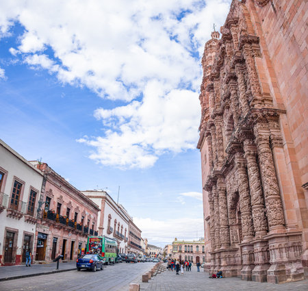 Zacatecas, Zacatecas, Mexico - November 22, 2019: Zacatecas, Zacatecas, Mexico - November 22, 2019: People walking the front gate of the Zacatecas Cathedral along the Hidalgo Avenueのeditorial素材