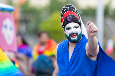 Cincinnati, Ohio, USA - June 22, 2019: The Cincinnati Pride Parade, Man wearing asian style face paint at the paradeのeditorial素材