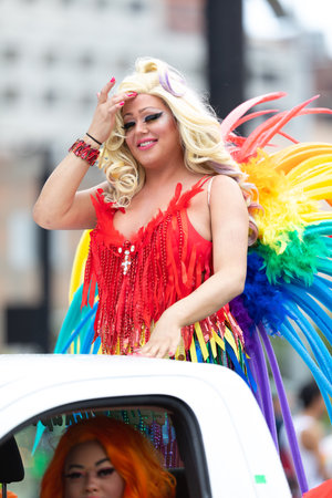 Cincinnati, Ohio, USA - June 22, 2019: The Cincinnati Pride Parade, Trangender wearing a colorful...
