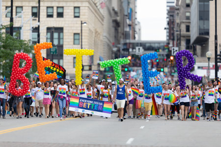 Cincinnati, Ohio, USA - June 22, 2019: The Cincinnati Pride Parade, large group of people carrying ...