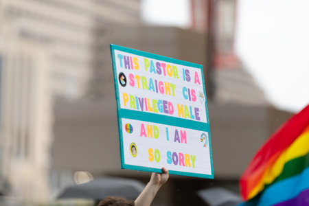 Cincinnati, Ohio, USA - June 22, 2019: The Cincinnati Pride Parade, Person holding a sign that says,...