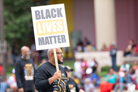 Indianapolis, Indiana, USA - September 28, 2019: The Circle City Classic Parade, Men carrying signs...