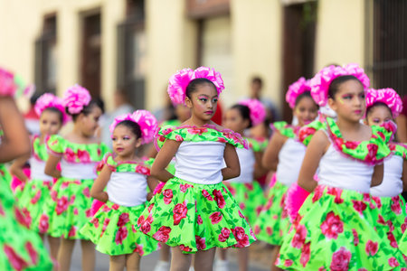 Matamoros, Tamaulipas, Mexico - November 20, 2019: The Mexican Revolution Day Parade, young mexican cheerleaders dancing down Sexta Street during the paradeのeditorial素材