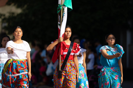 Matamoros, Tamaulipas, Mexico - November 20, 2019: The Mexican Revolution Day Parade, Student Honor Guard, scorting the Mexican flag down Sexta Streetのeditorial素材