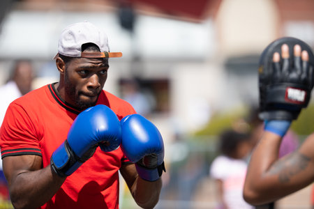 Chicago, Illinois, USA - August 8, 2019: The Bud Billiken Parade, Man performing a display of boxing techniques at the paradeのeditorial素材
