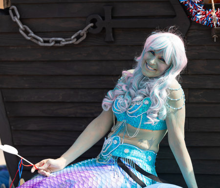 Arlington, Texas, USA - July 4, 2019: Arlington 4th of July Parade, Float in shape of a Pirate ship, with woman dress up as a mermiad at the paradeのeditorial素材