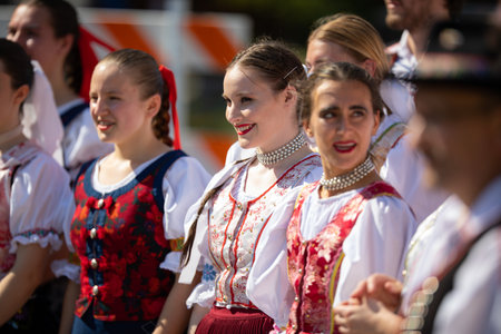 Whiting, Indiana, USA - July 27, 2019: Pierogi Fest, Slovakian dancers, wearing traditional clothing, waiting for their turn to danceのeditorial素材