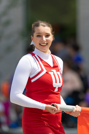 Indianapolis, Indiana, USA - May 25, 2019: Indy 500 Parade, Lady from the Indiana University smiles...