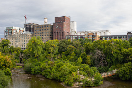 View down Mississippi River with view of the Old Mills on the riverbank, in Minneapolis, Minnesota, USAの写真素材