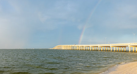Rockport, Texas, USA - September 18, 2021: The Lyndon B Johnson Causeway with a rainbow on the backgroundのeditorial素材