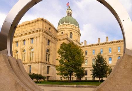 Indianapolis, Indiana, USA - October 19, 2021: The Indiana State Capitol seen across the sculpture by Dale Enochs known as Time Flowのeditorial素材