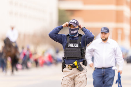Laredo, Texas, USA - February 19, 2022: The Anheuser-Busch Washingtonâs Birthday Parade, Police officer patroling the parade routeのeditorial素材