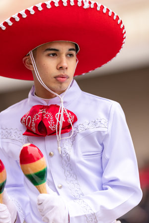 Brownsville, Texas, USA - February 26, 2022: Charro Days Grand International Parade, Members of the Rivera High School Raider Marching Band performing at the paradeのeditorial素材