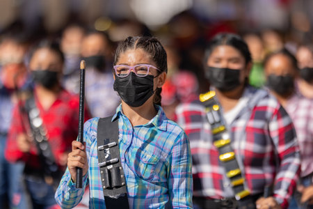 Matamoros, Tamaulipas, Mexico - November 26, 2022: The Desfile del 20 de Noviembre, Members of the Escuela primaria federal Josefina Menchaca marching band, performing at the paradeのeditorial素材