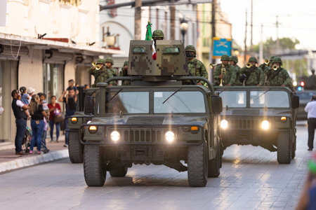 Matamoros, Tamaulipas, Mexico - September 16, 2022: Desfile 16 de Septiembre, Humvees transporting members of the Mexican Army Marching Bandのeditorial素材