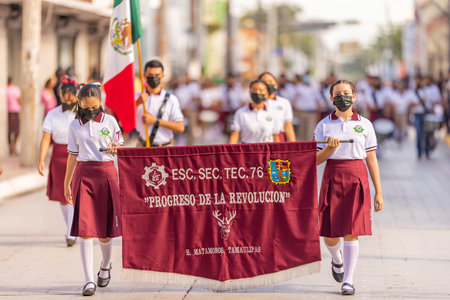 Matamoros, Tamaulipas, Mexico - September 16, 2022: Desfile 16 de Septiembre, Members of the Escuela Secundaria Tecnologica 76 Marching Band performing at the paradeのeditorial素材