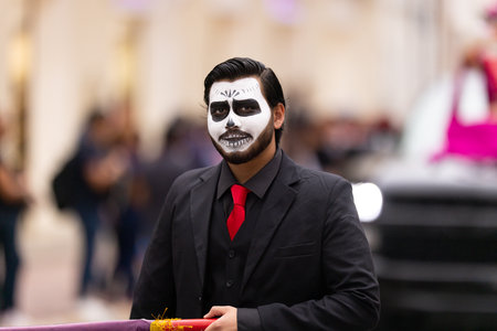 Matamoros, Tamaulipas, Mexico - November 1, 2022: Dia de los Muertos Parade, Young man wearing a day of the dead outfit during the paradeのeditorial素材