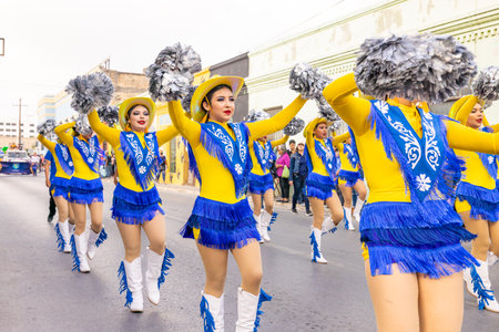 Matamoros, Tamaulipas, Mexico - February 25, 2023: Fiestas Mexicanas Parade, Cheerleaders from the Juan Jose de la Garza High School performing at the paradeのeditorial素材