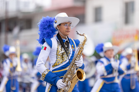 Valle Hermoso, Tamaulipas, Mexico - March 18, 2023: City Anniversary Parade, The Toros marching band from the Juan Jose de la Garza High School, performing at the paradeのeditorial素材