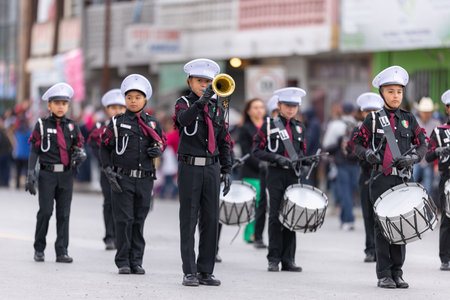 Valle Hermoso, Tamaulipas, Mexico - March 18, 2023: City Anniversary Parade, Marching Band from the 18 de Marzo, primary school, performing at the paradeのeditorial素材