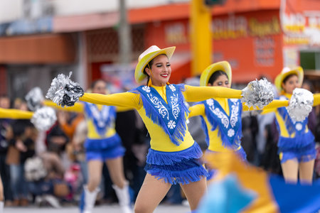 Valle Hermoso, Tamaulipas, Mexico - March 18, 2023: City Anniversary Parade, Cheerleaders from the Lic. y Gral. Juan Jose de la Garza High School, dancing at the paradeのeditorial素材