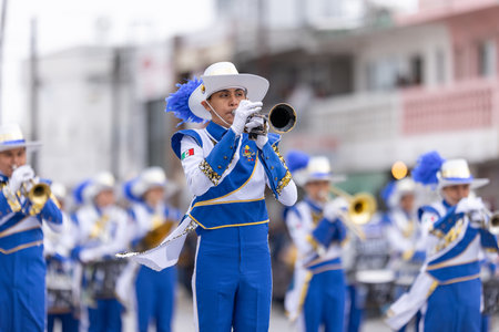 Valle Hermoso, Tamaulipas, Mexico - March 18, 2023: City Anniversary Parade, The Toros marching band from the Juan Jose de la Garza High School, performing at the paradeのeditorial素材