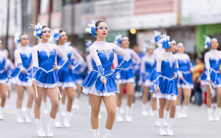 Valle Hermoso, Tamaulipas, Mexico - March 18, 2023: City Anniversary Parade, Cheerleaders from the Lic. Adolfo Lopez Mateos middle school performing at the paradeのeditorial素材