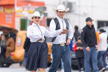 Valle Hermoso, Tamaulipas, Mexico - March 18, 2023: City Anniversary Parade, Dance Group wearing traditional clothing from the UAT university performing at the paradeのeditorial素材
