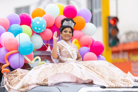 Valle Hermoso, Tamaulipas, Mexico - March 18, 2023: City Anniversary Parade, Beauty queen wearing her crown and a traditional dress, riding a vehicle during the paradeのeditorial素材