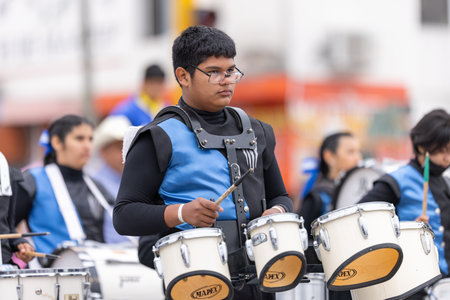 Valle Hermoso, Tamaulipas, Mexico - March 18, 2023: City Anniversary Parade, Members of the  Marching band from the Lic. Adolfo Lopez Mateos, middle school, performing at the paradeのeditorial素材