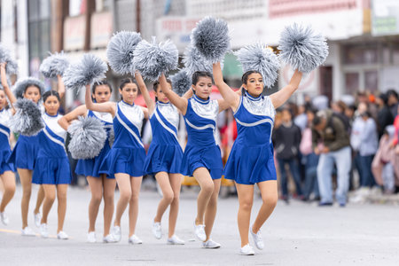 Valle Hermoso, Tamaulipas, Mexico - March 18, 2023: City Anniversary Parade, Cheerleaders from the Lic. Adolfo Lopez Mateos middle school performing at the paradeのeditorial素材