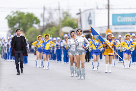 Valle Hermoso, Tamaulipas, Mexico - March 18, 2023: City Anniversary Parade, Cheerleaders from the Lic. y Gral. Juan Jose de la Garza High School, dancing at the paradeのeditorial素材