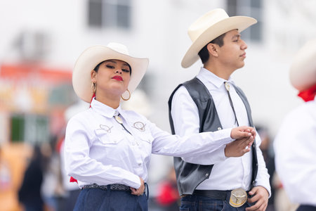 Valle Hermoso, Tamaulipas, Mexico - March 18, 2023: City Anniversary Parade, Dance Group wearing traditional clothing from the UAT university performing at the paradeのeditorial素材
