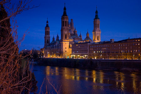 Zaragoza, Aragona, Spain - March 8, 2008: view of the city by night, Basilica of Our Lady of the Pillar and the Ebro Riverのeditorial素材