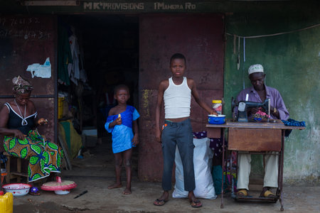 Yongoro, Sierra Leone - June 01, 2013: West Africa, the village of Yongoro in front of Freetown, the tailorのeditorial素材