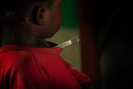 Mabendo, Sierra Leone - May 31, 2013: Mabendo, small village in Sierra Leone, Africa, a child with a feverのeditorial素材