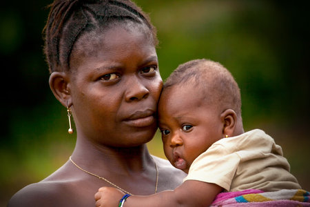 Mabendo, Sierra Leone, Africa - May 31, 2013: Mabendo, small village in Sierra Leone, portrait of mother and childのeditorial素材