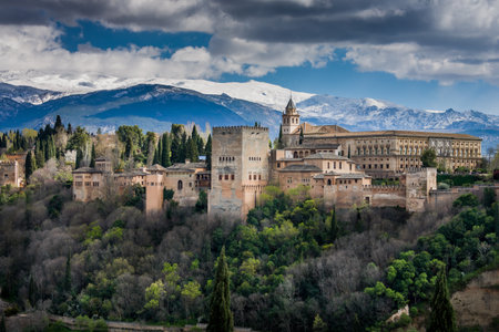 Granada, Spain - March 23, 2008 - view of Alhambra Palace in Granada, Spain with Sierra Nevada mountains at the backgroundのeditorial素材