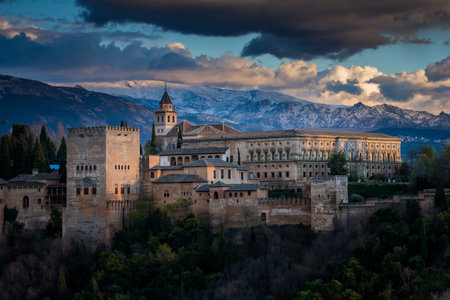 Granada, Spain - March 23, 2008 - view of Alhambra Palace in Granada, Spain with Sierra Nevada mountains at the backgroundのeditorial素材