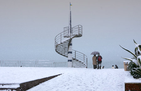 Cecina Marina, Livorno, Tuscany - snowfall in the seaside town, the iron staircase in Via della Vittoriaの写真素材