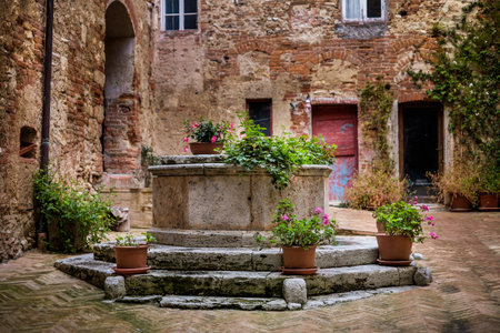 Serre di Rapolano are famous for being close to Rapolano headquarters of tourist spas with aqueous sulfuric, the medieval town with its narrow streets, ancient well for rain waterの写真素材
