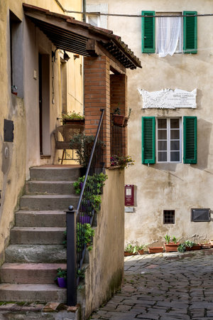 Castagneto Carducci is one of the most popular towns on the Etruscan Coast, Leghorn, Italy, small medieval street, with the house where he lived the poet Giosue' Carducciの写真素材
