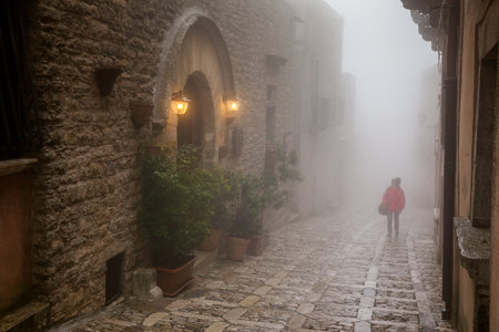 Erice, Trapani, Sicily, Italy - view of the city in the fogの写真素材